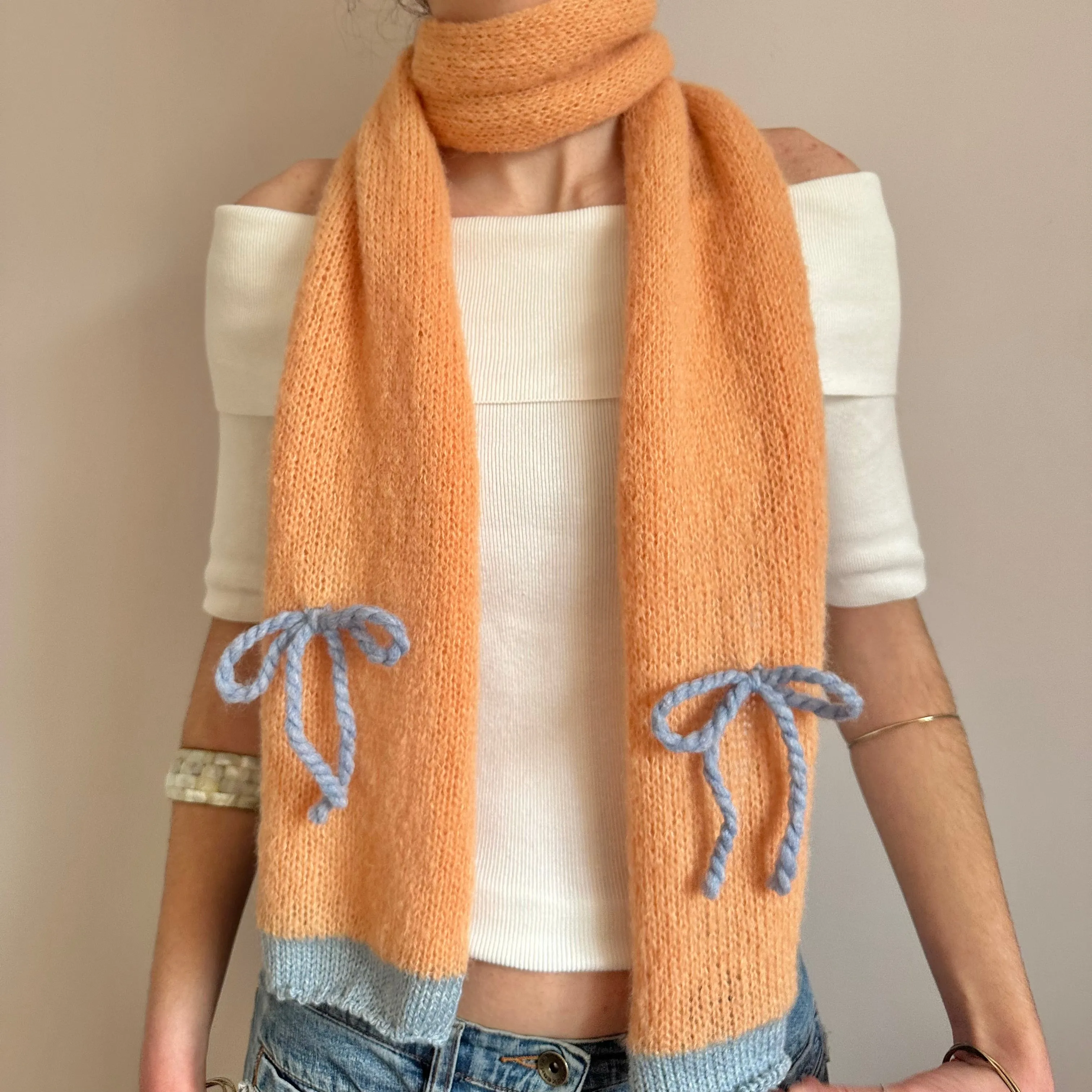 Handmade knitted orange and baby blue mohair bow scarf