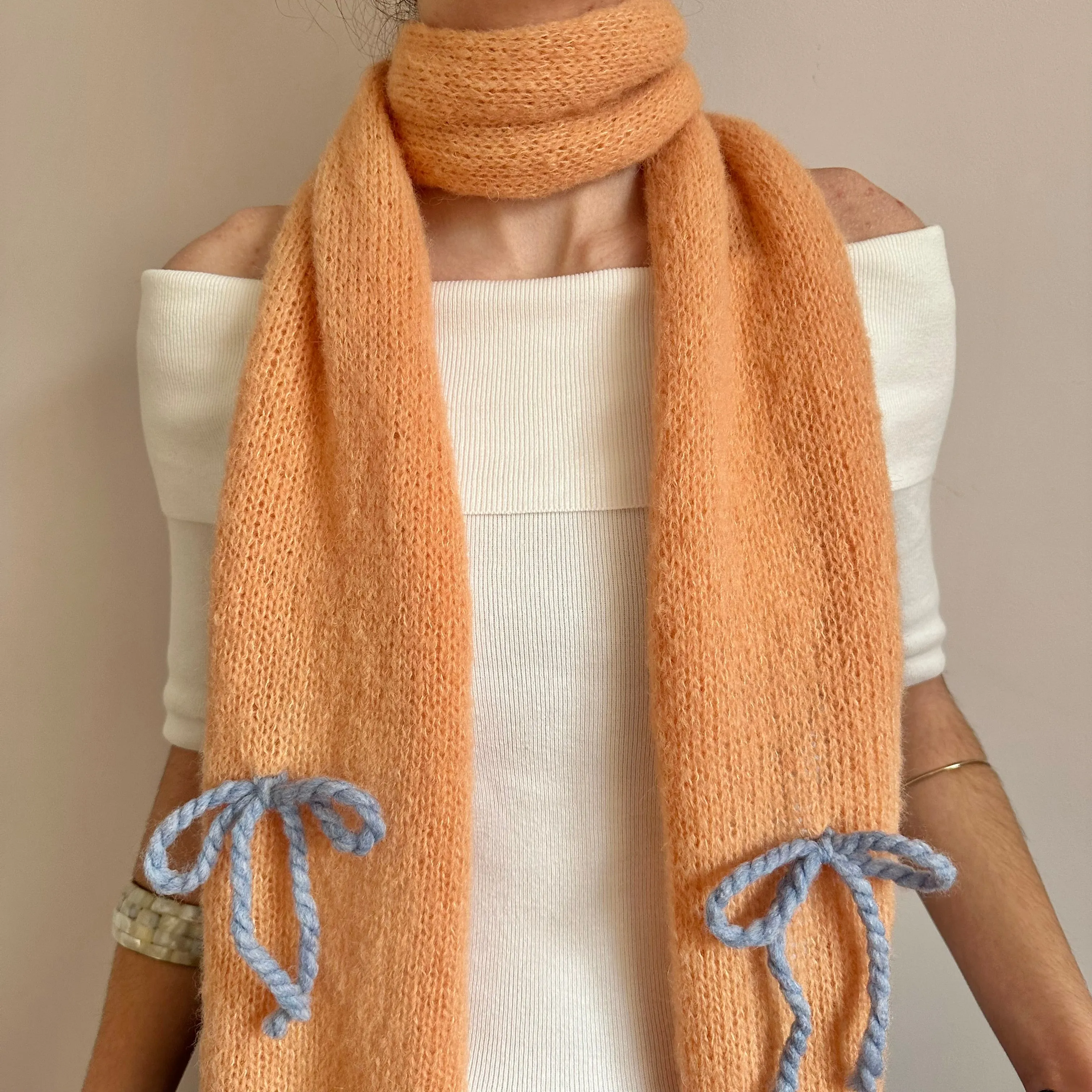 Handmade knitted orange and baby blue mohair bow scarf