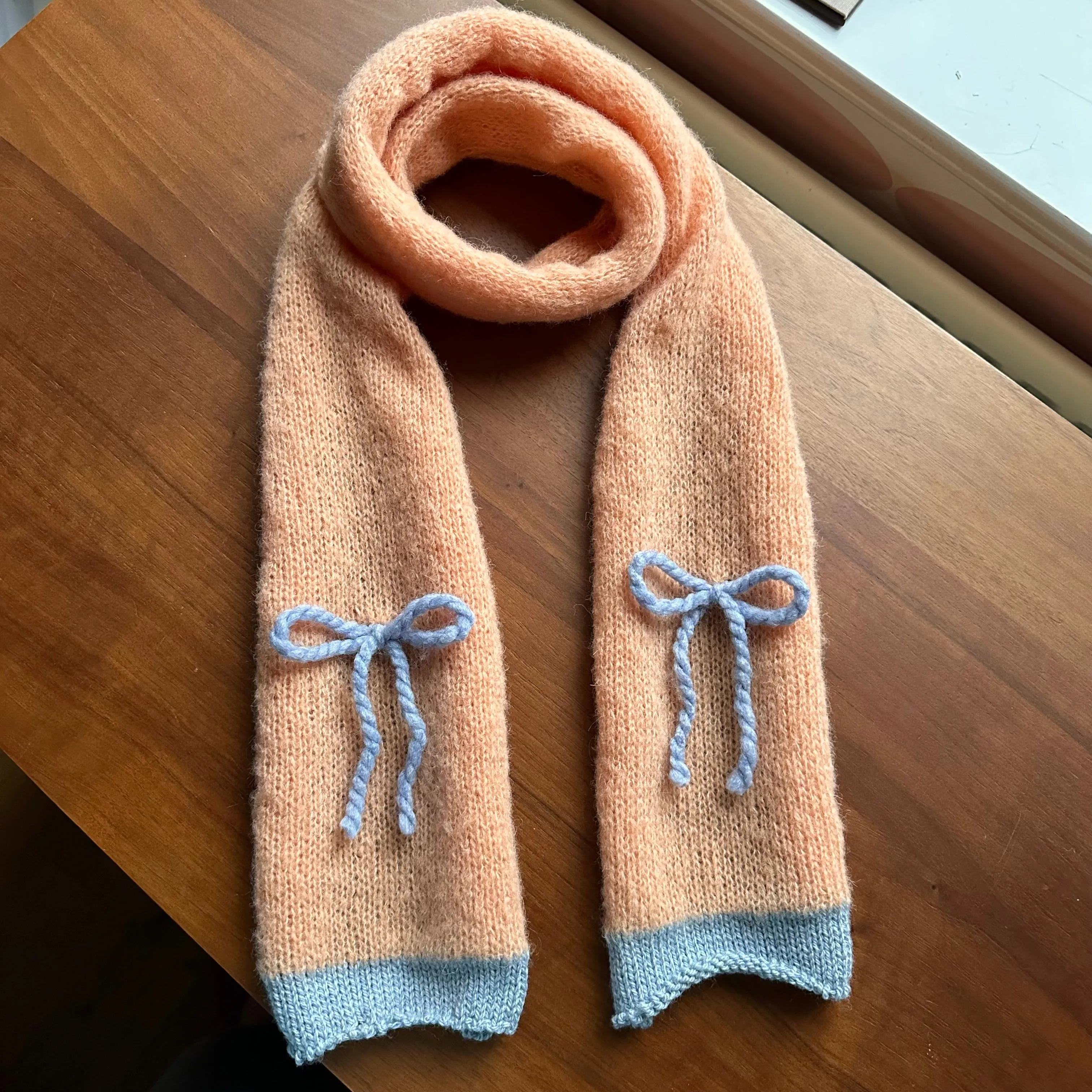 Handmade knitted orange and baby blue mohair bow scarf