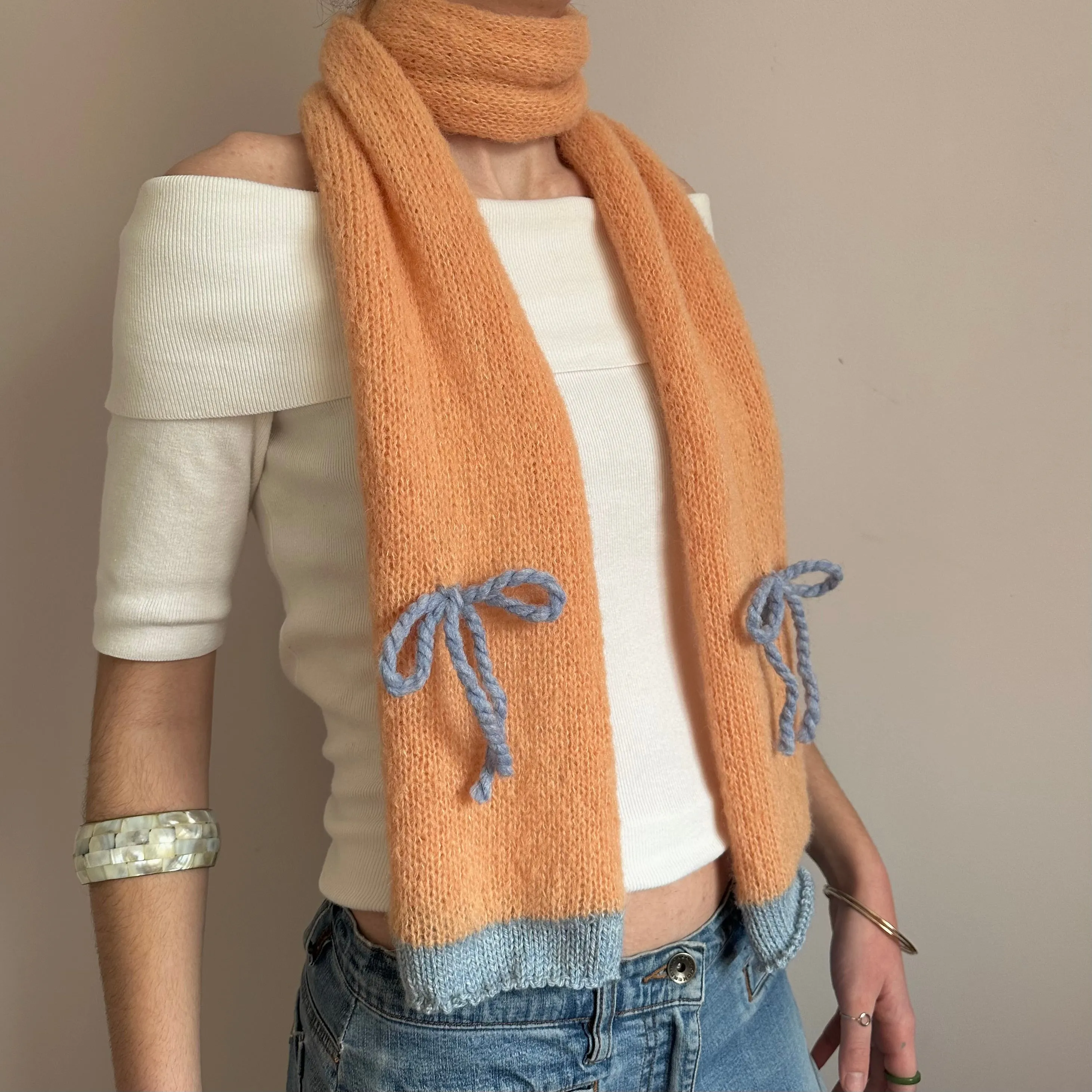 Handmade knitted orange and baby blue mohair bow scarf