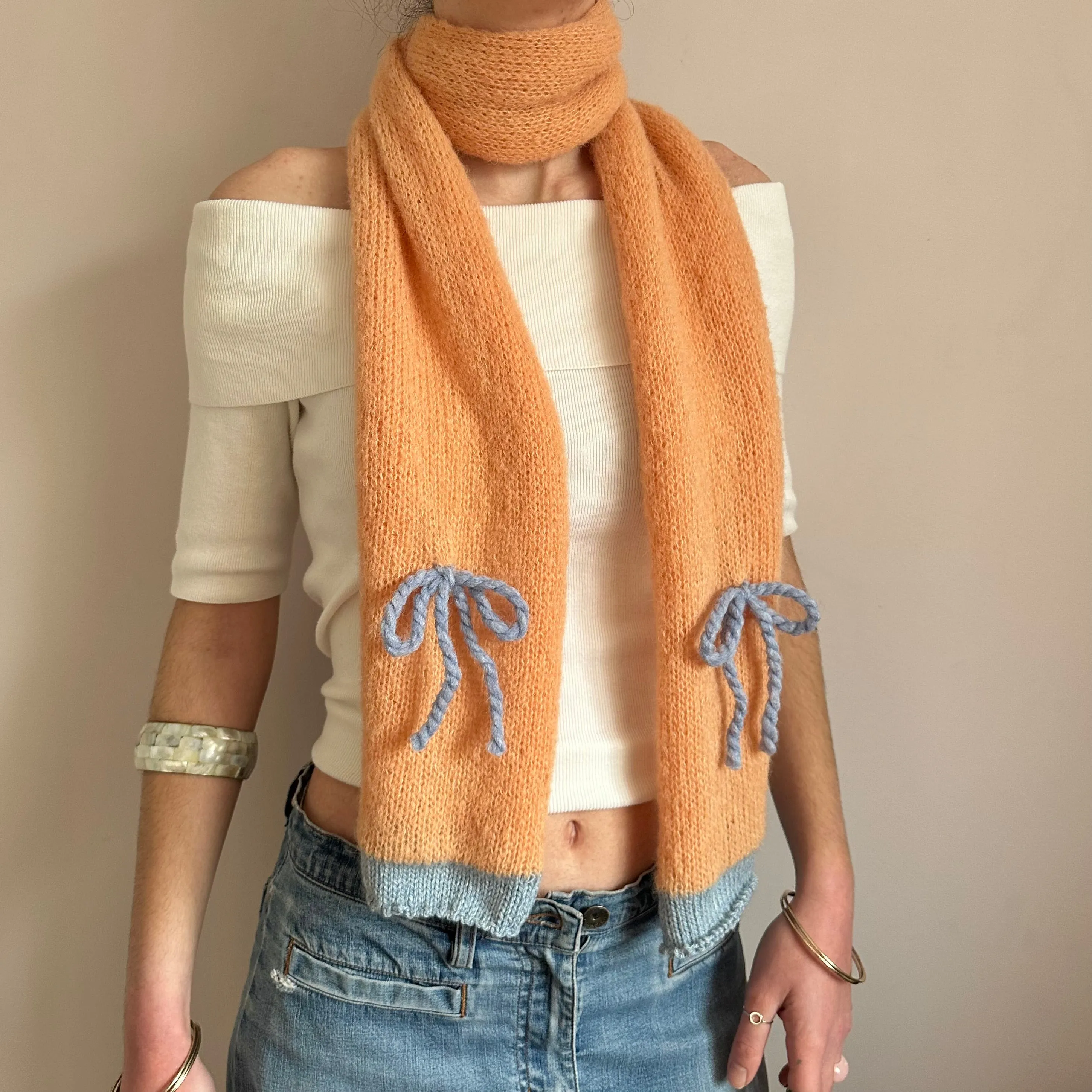 Handmade knitted orange and baby blue mohair bow scarf