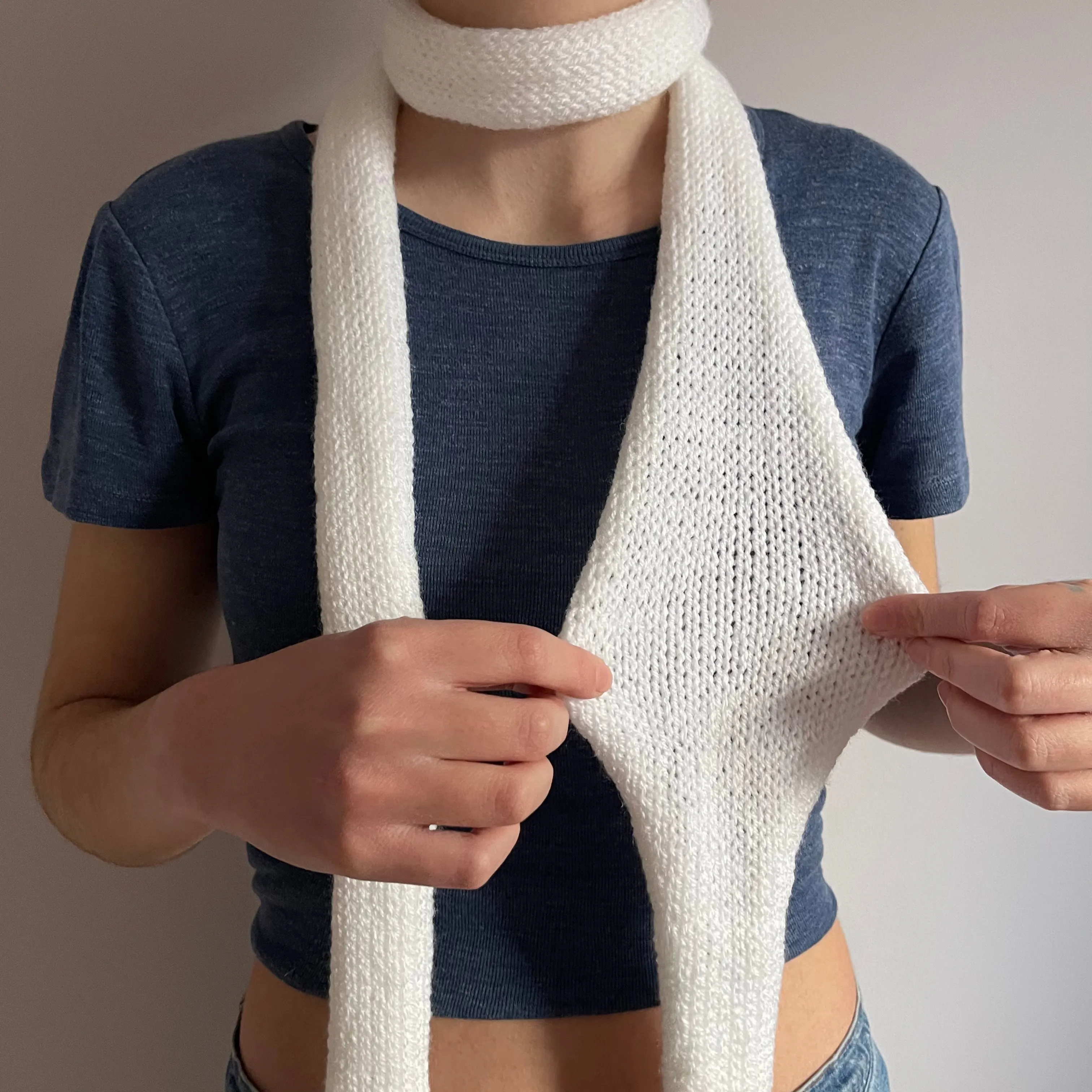 Handmade knitted skinny scarf in white